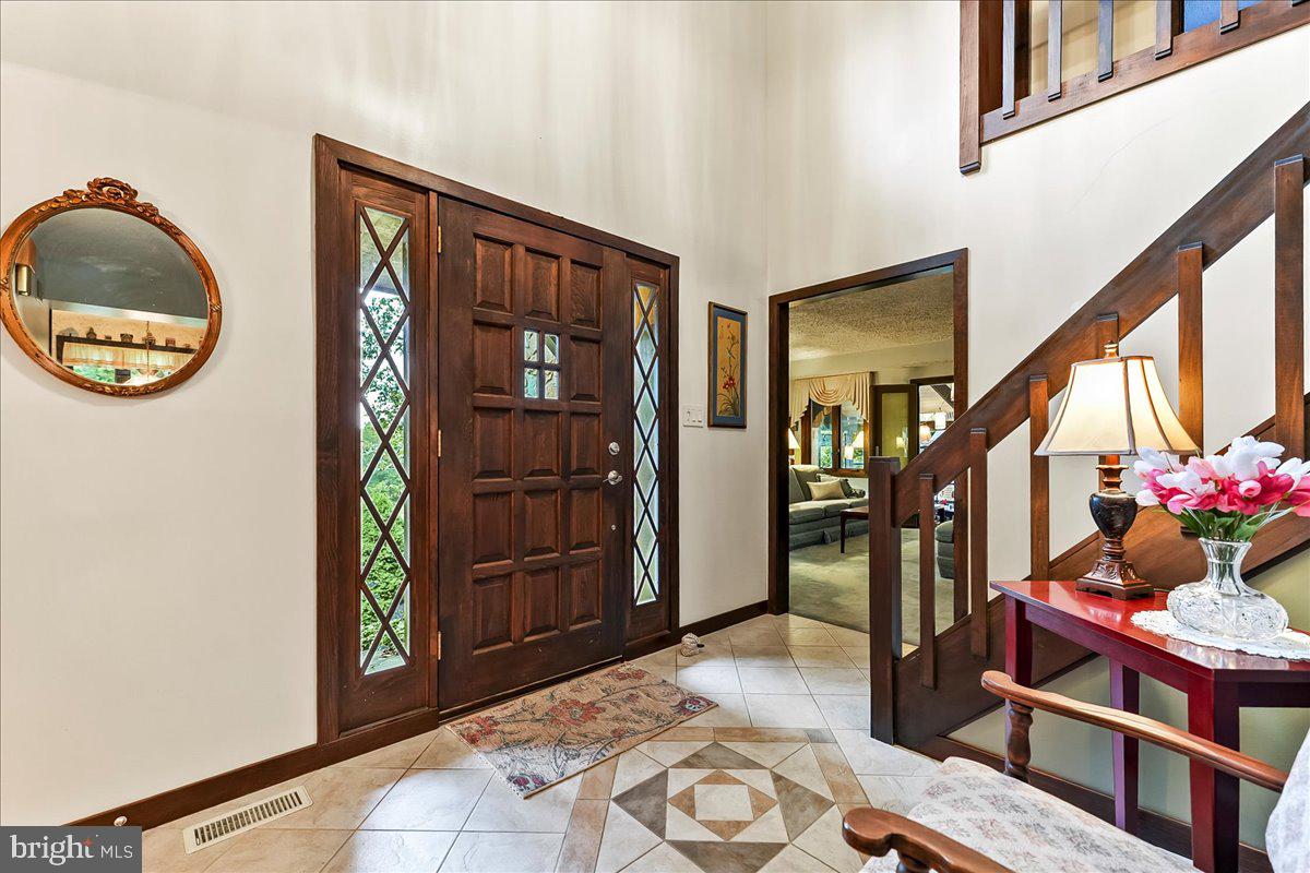 1200 Dunsinane Hill Chester Springs, PA 19425 - Photo 4 of 42 a view of an entryway with wooden floor