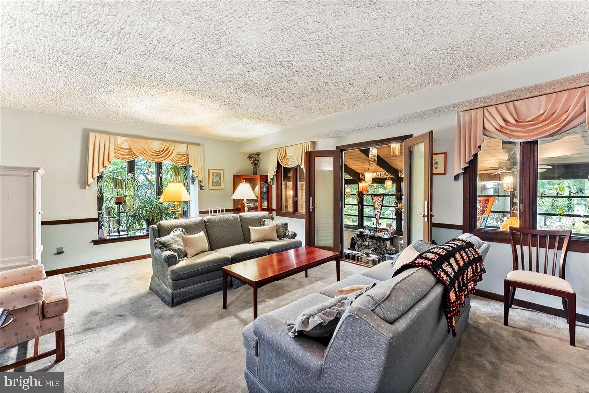 1200 Dunsinane Hill Chester Springs, PA 19425 - Photo 5 of 42 a living room with furniture and a large window