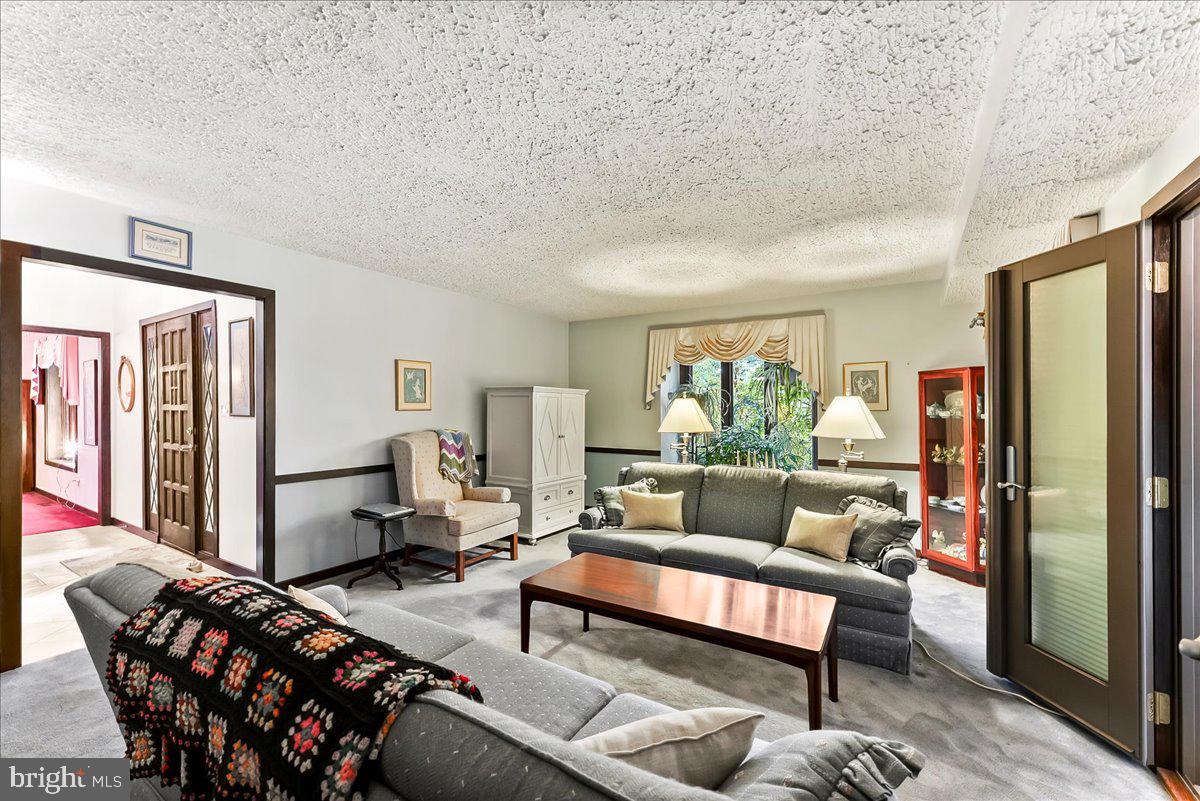1200 Dunsinane Hill Chester Springs, PA 19425 - Photo 6 of 42 a living room with furniture and a window