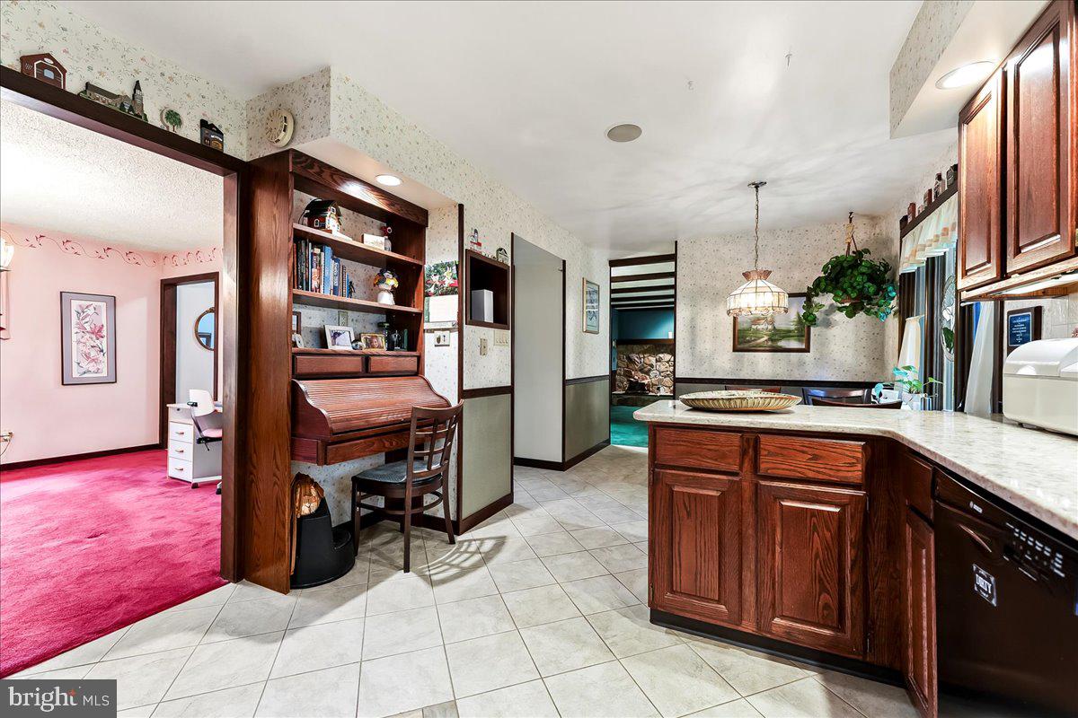 1200 Dunsinane Hill Chester Springs, PA 19425 - Photo 10 of 42 a kitchen with stainless steel appliances granite countertop a refrigerator and a stove