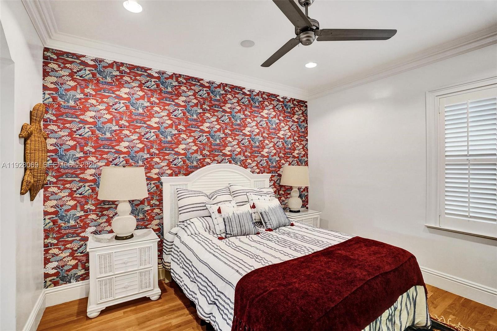 1281 Banyan Road Boca Raton, FL 33432 - Photo 38 of 69 a bedroom with a bed and a painting on the wall