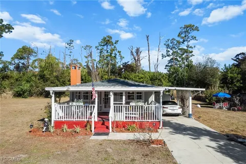 an outdoor space with furniture and garden