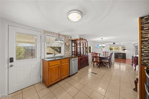 a kitchen with stainless steel appliances granite countertop a stove and a sink with cabinets