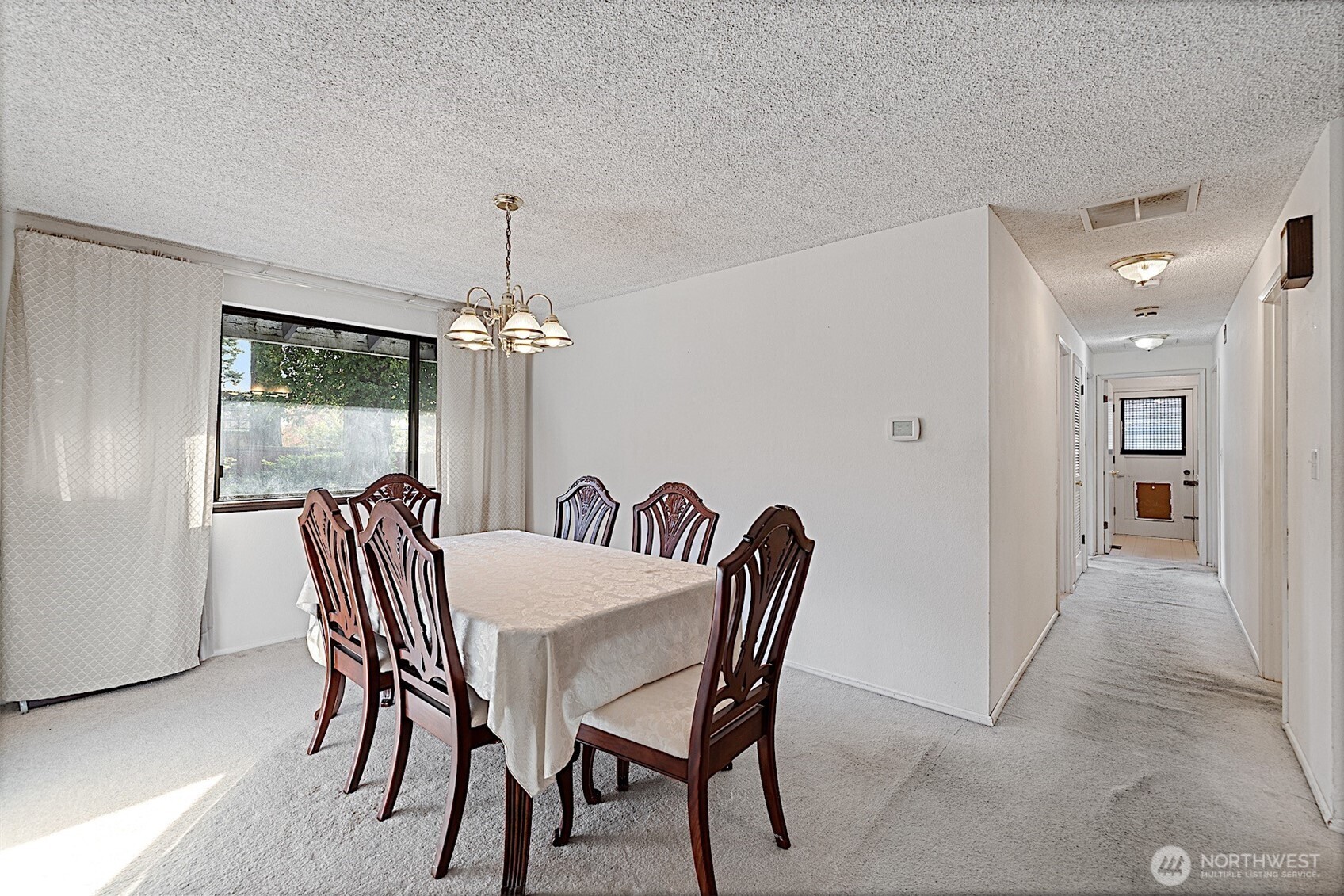 7407 Onyx Drive Southwest Lakewood, WA 98498 - Photo 17 of 40 a dining room with furniture window and wooden floor