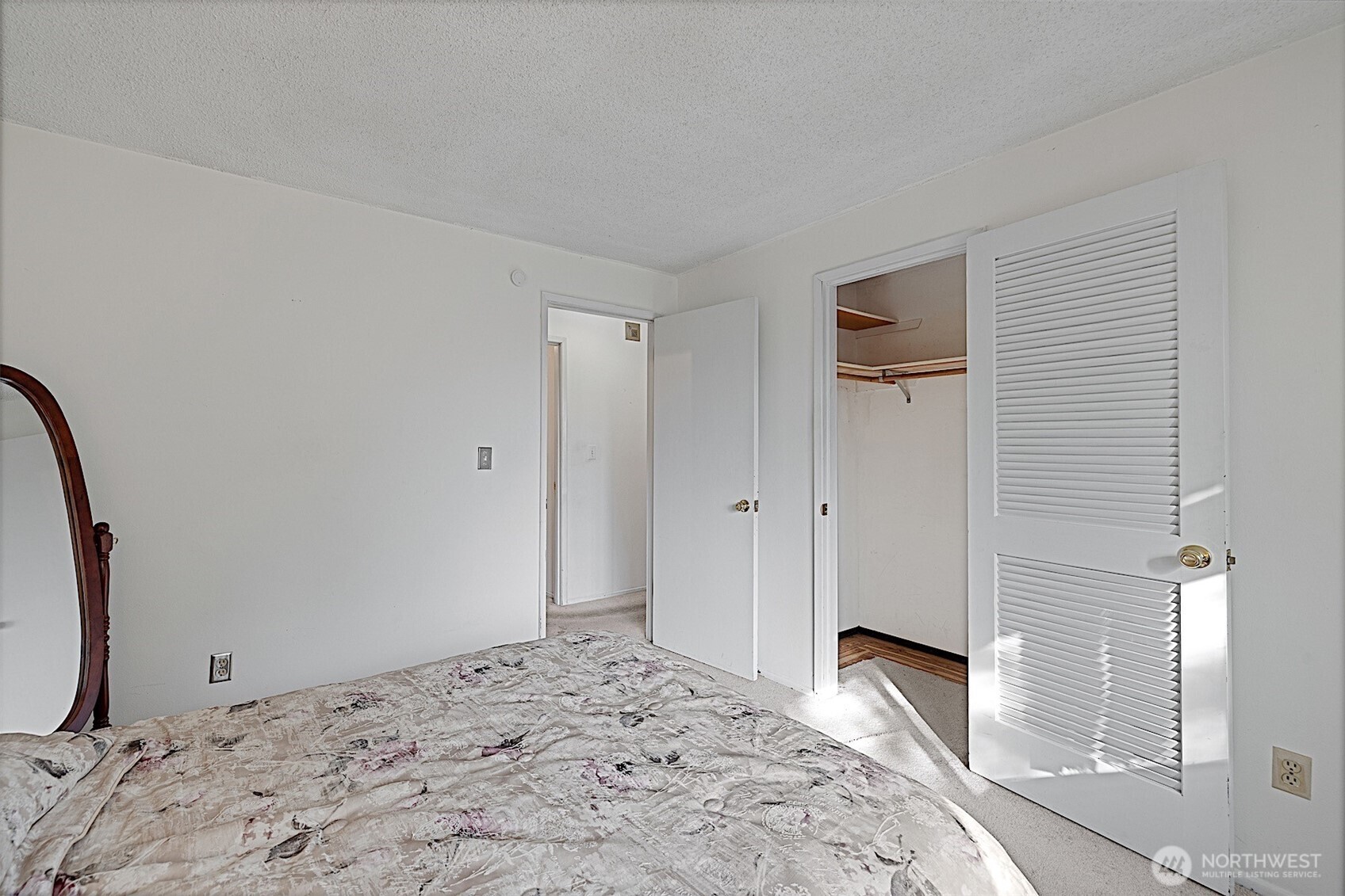 7407 Onyx Drive Southwest Lakewood, WA 98498 - Photo 20 of 40 a bedroom with a bed and a mirror