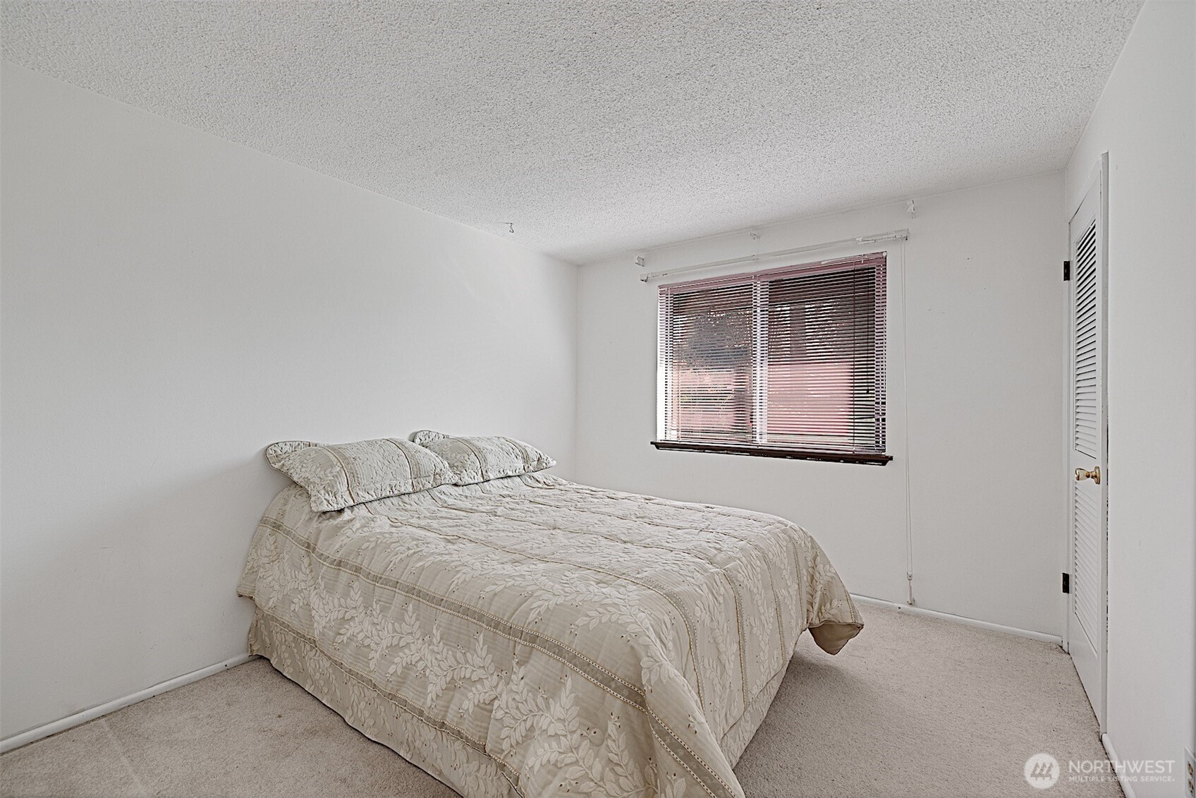 7407 Onyx Drive Southwest Lakewood, WA 98498 - Photo 22 of 40 a bedroom with bed and window