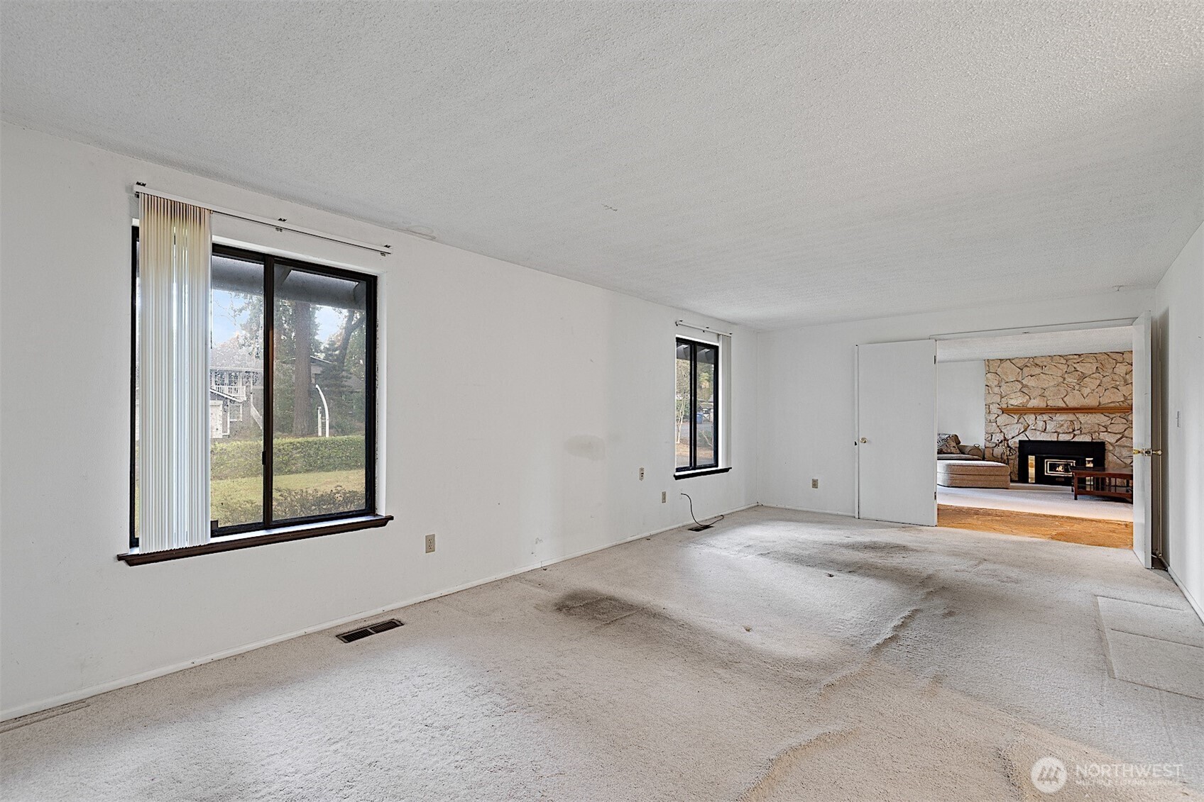 7407 Onyx Drive Southwest Lakewood, WA 98498 - Photo 27 of 40 an empty room with windows and fireplace