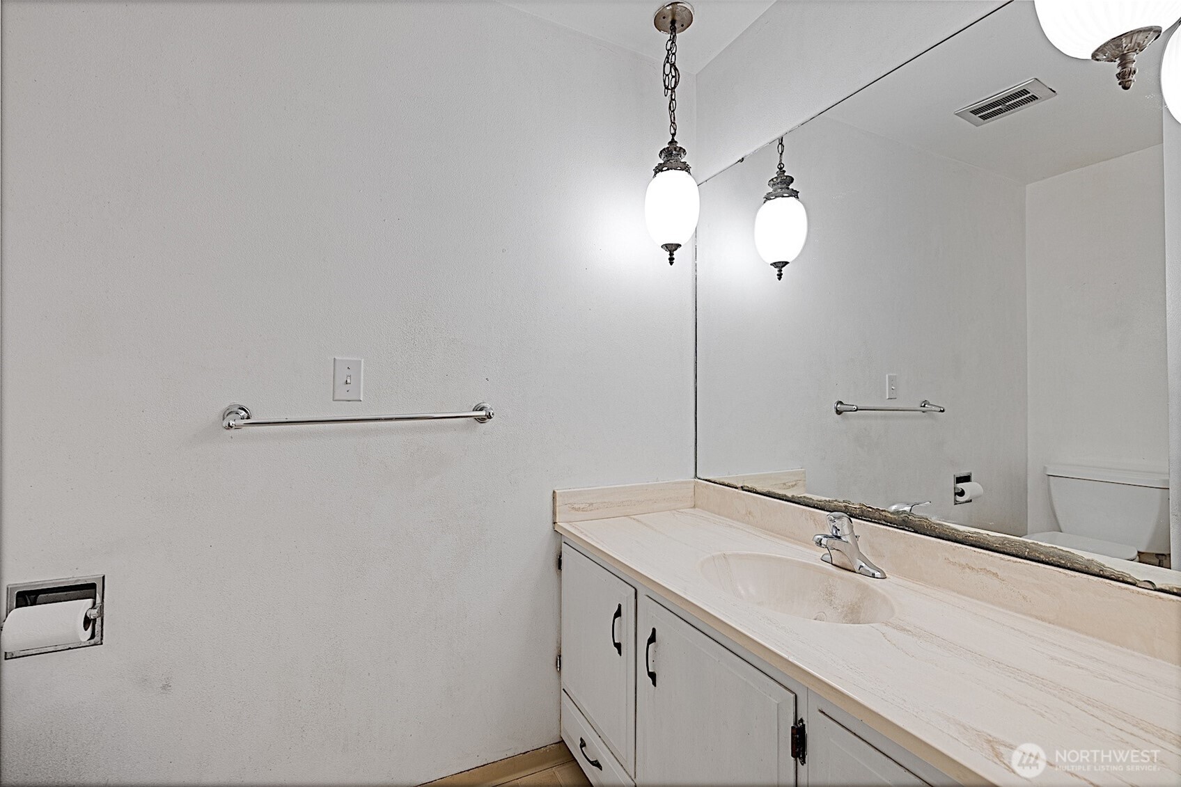 7407 Onyx Drive Southwest Lakewood, WA 98498 - Photo 32 of 40 a bathroom with a sink and a mirror