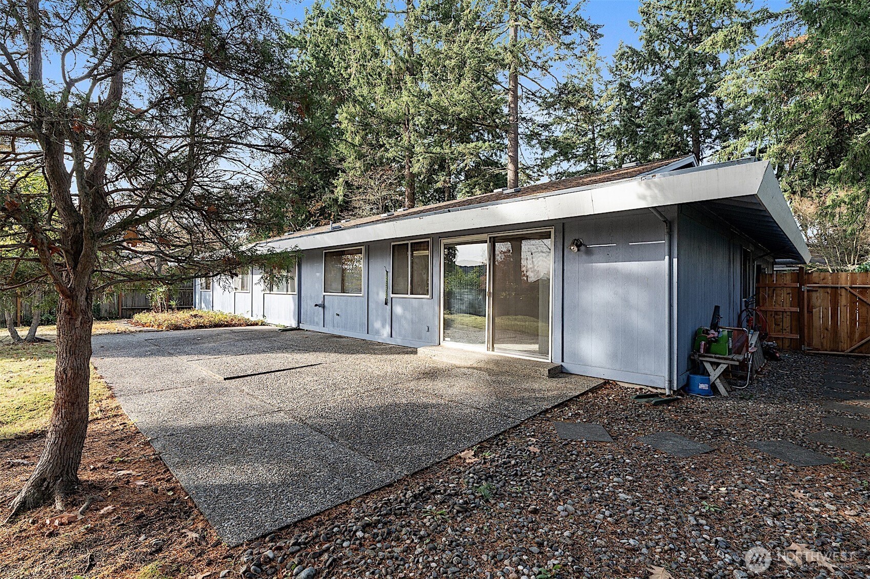 7407 Onyx Drive Southwest Lakewood, WA 98498 - Photo 36 of 40 a view of a house with a yard and large tree