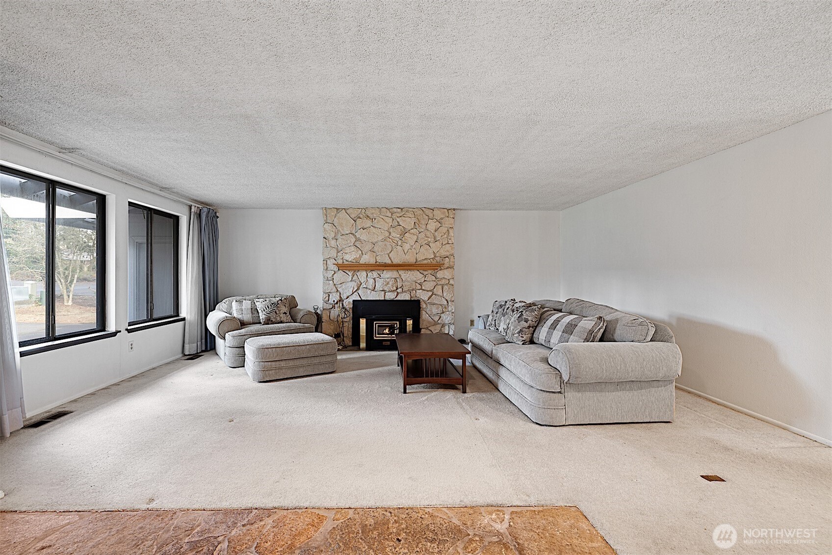 7407 Onyx Drive Southwest Lakewood, WA 98498 - Photo 5 of 40 a living room with furniture and a fireplace