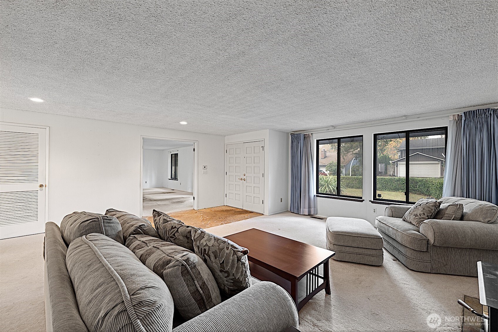 7407 Onyx Drive Southwest Lakewood, WA 98498 - Photo 7 of 40 a living room with a couch and a large window