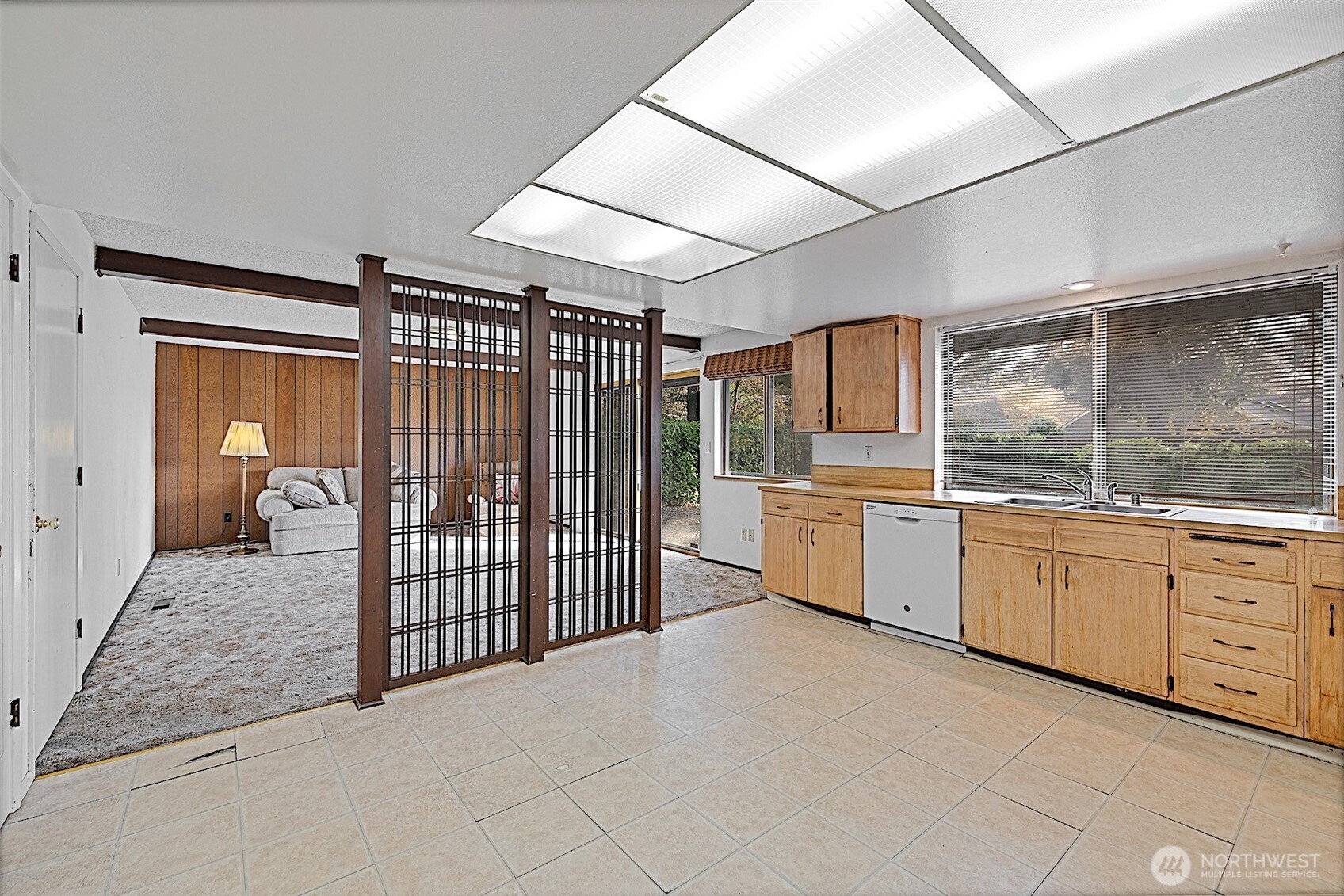 7407 Onyx Drive Southwest Lakewood, WA 98498 - Photo 10 of 40 a large white room with a large window and white kitchen