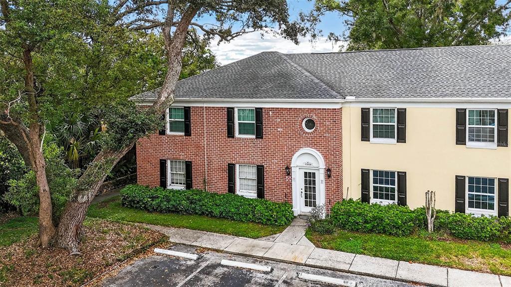 13824 Orange Sunset Drive, Unit 202 Tampa, FL 33618 - Photo 11 of 20 a front view of a house with garden
