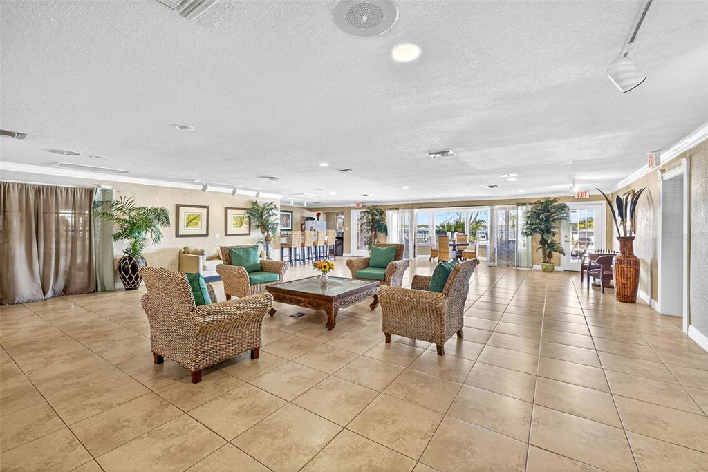 13824 Orange Sunset Drive, Unit 202 Tampa, FL 33618 - Photo 18 of 20 a lobby with furniture and floor to ceiling window