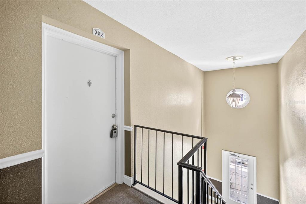 13824 Orange Sunset Drive, Unit 202 Tampa, FL 33618 - Photo 6 of 20 a view of a hallway with windows