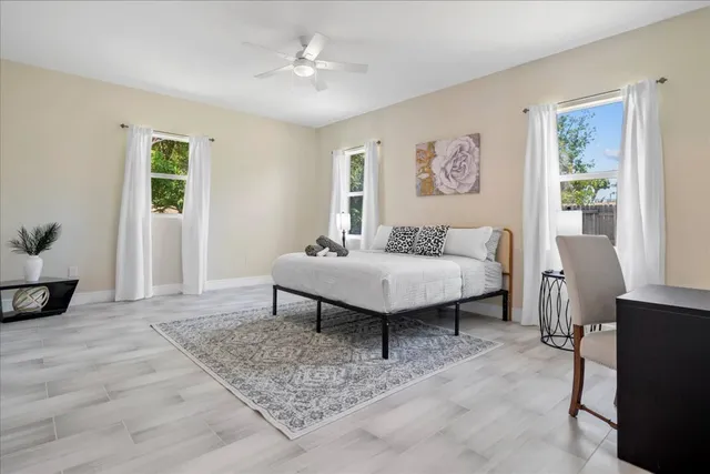 a bedroom with a bed and a table in it