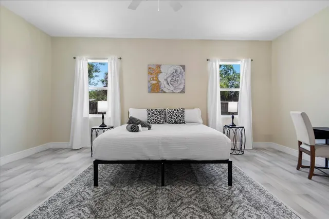a view of a dining room with furniture and window