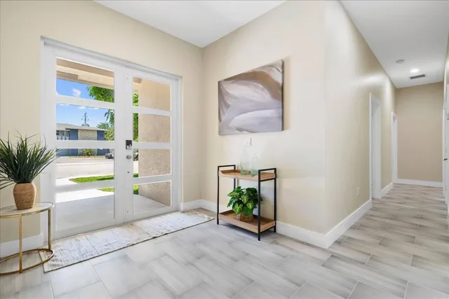 a view of kitchen with furniture and a potted plant