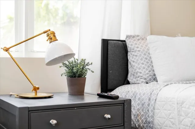 a bedroom with a bed and dresser