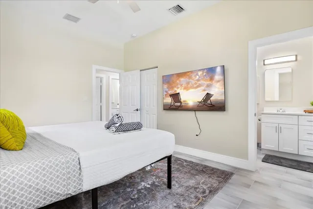 a bedroom with a bed and a window