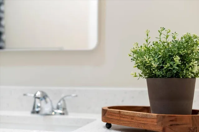 a bedroom with a bed and a night stand