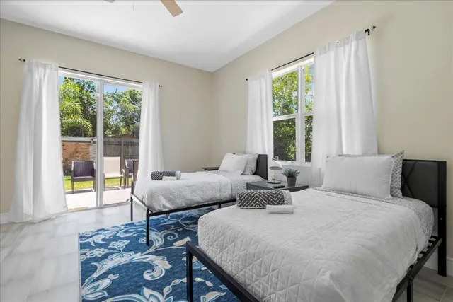 a bedroom with a bed and a table