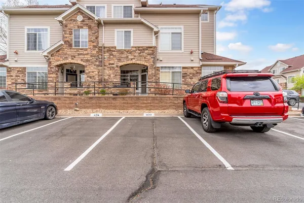 a front view of a house with parking space