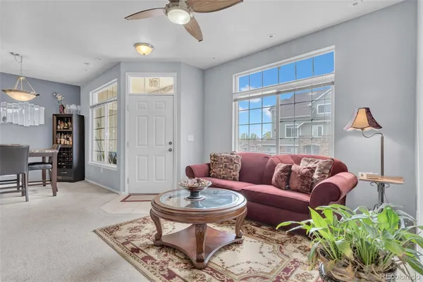 a living room with furniture and a large window