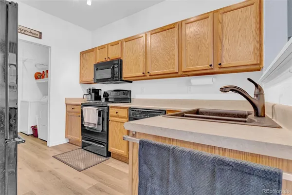 a kitchen with stainless steel appliances granite countertop a sink stove and microwave