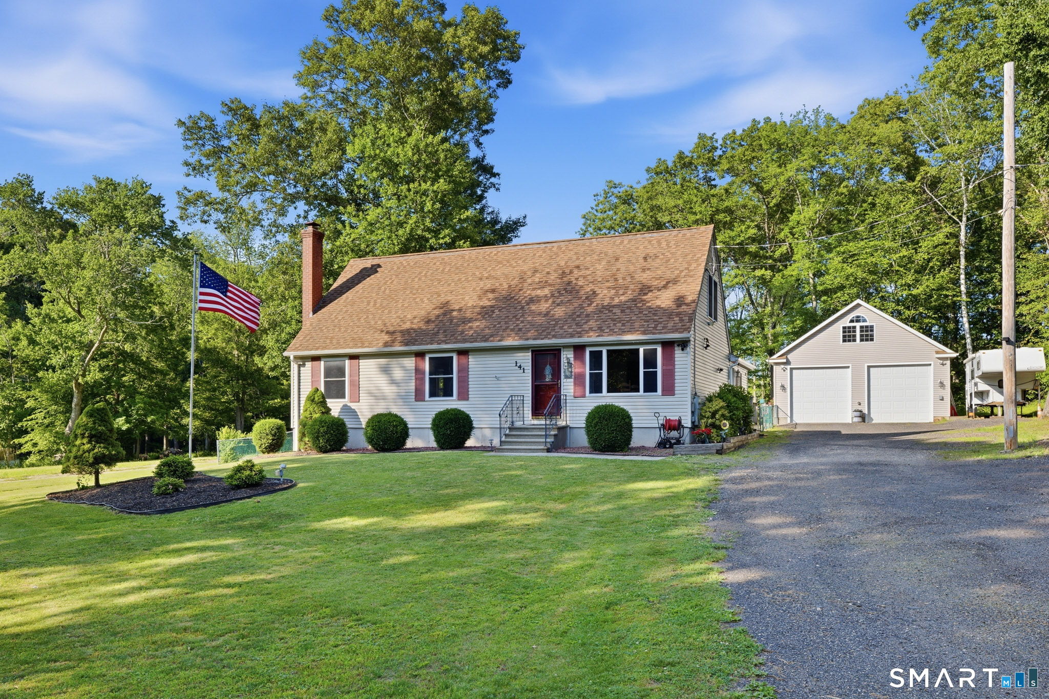 141 Hop River Road Coventry, CT 06238 - Photo 1 of 40 a view of a house with a big yard and large trees