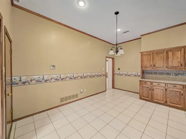 a bathroom with a granite countertop sink and washing machine