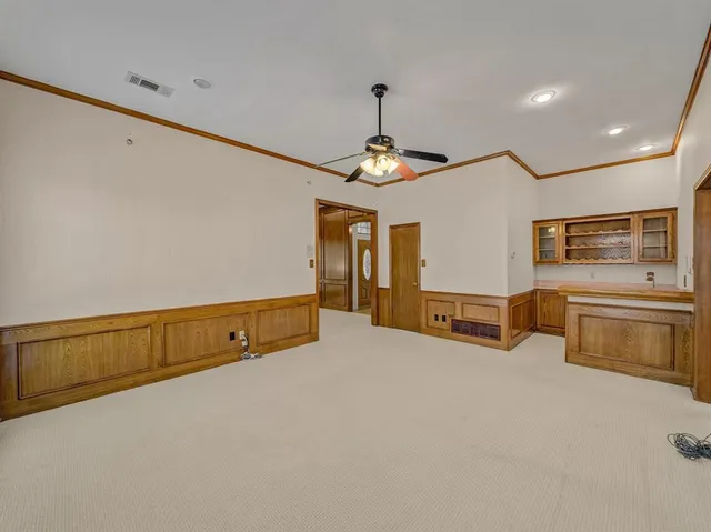 a room with furniture and flat screen tv