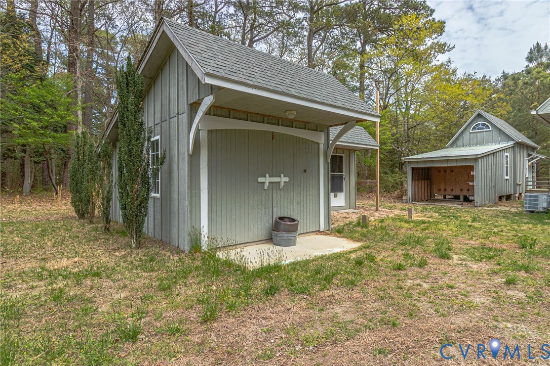 193 Deep Water Lane Reedville, VA 22539 - Photo 66 of 84 a front view of a house with garden