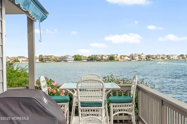 a view of a balcony with an ocean view