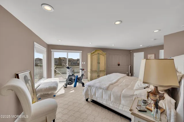 a bedroom with a bed and a chair