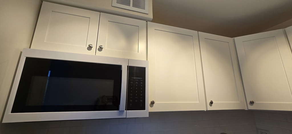 14 Concord Avenue, Unit 312 Cambridge, MA 02138 - Photo 12 of 19 a room with a door