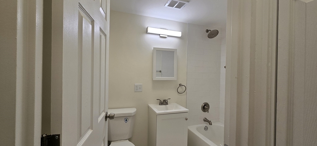 14 Concord Avenue, Unit 312 Cambridge, MA 02138 - Photo 15 of 19 a bathroom with a sink a toilet and shower