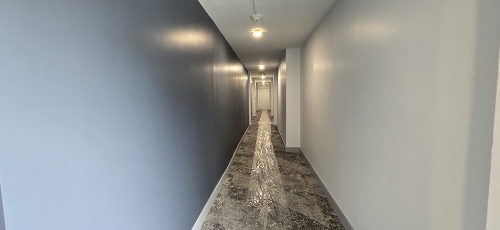 14 Concord Avenue, Unit 312 Cambridge, MA 02138 - Photo 3 of 19 a view of a hallway with wooden floor