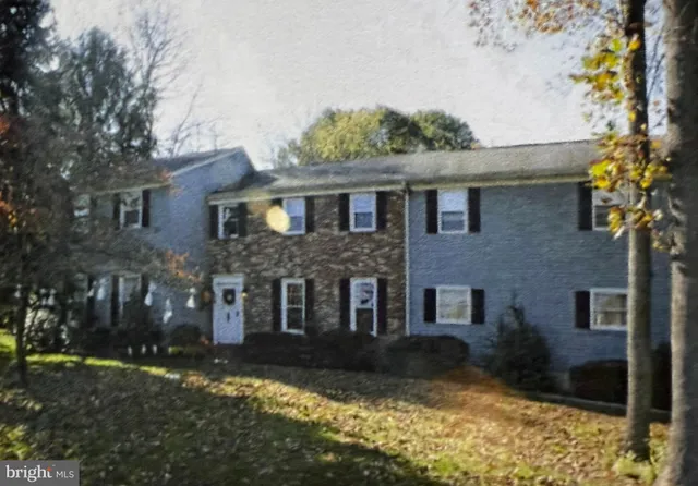 a living room with furniture or couch and a wooden floor