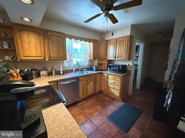 a living room with fireplace furniture and a flat screen tv