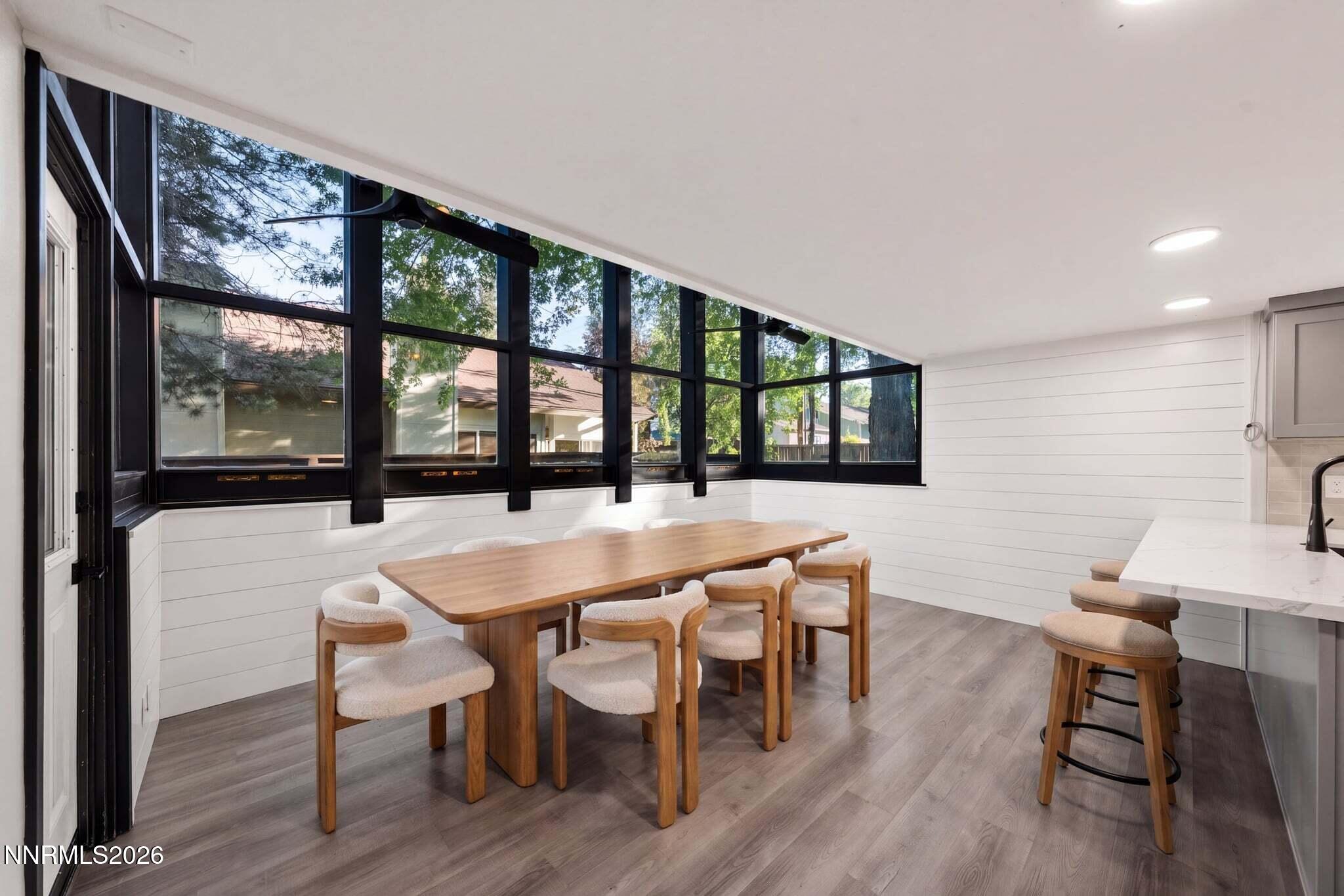 430 Angela Place Reno, NV 89509 - Photo 17 of 48 a dining room with furniture a chandelier and wooden floor