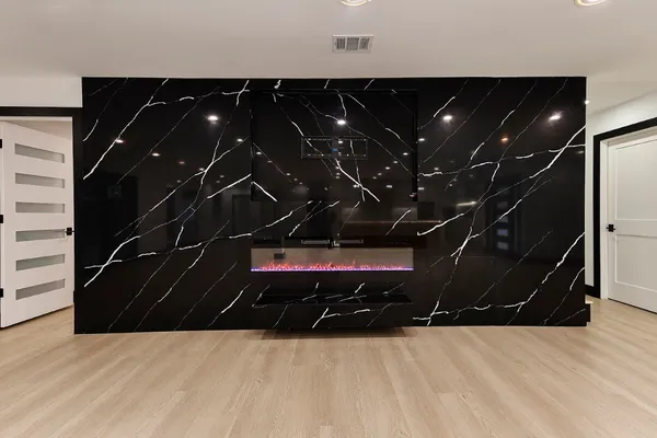 a view of kitchen with kitchen island and stainless steel appliances
