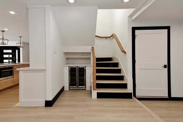 a kitchen with a refrigerator and cabinets
