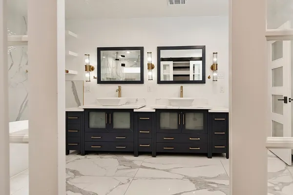 a bathroom with a sink a toilet and mirror