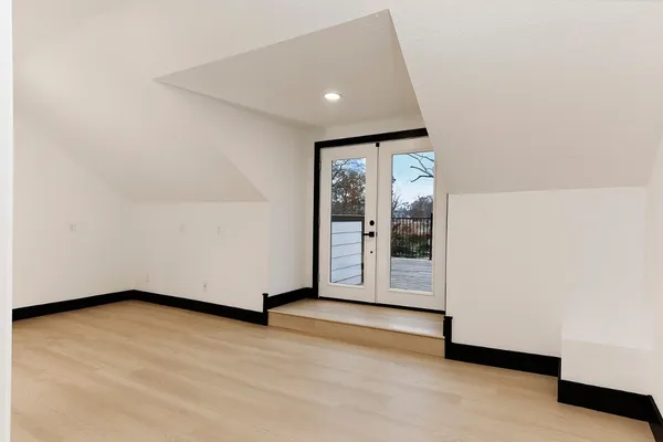 a view of room with hardwood floor