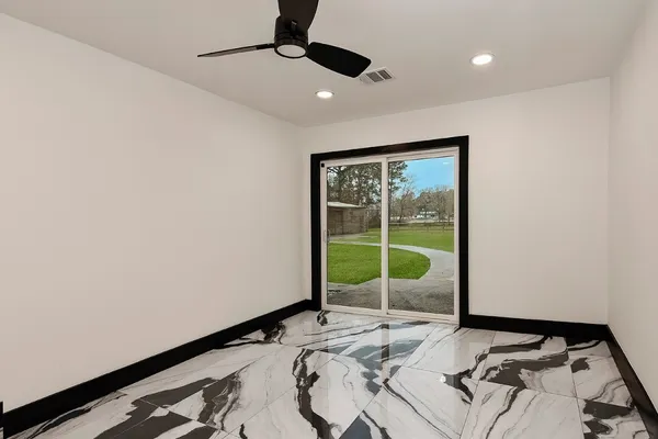 a view of a chairs and table in the patio