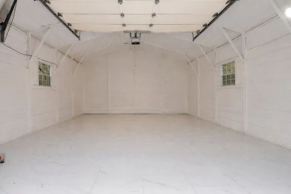 a view of a backyard with a tub and tree