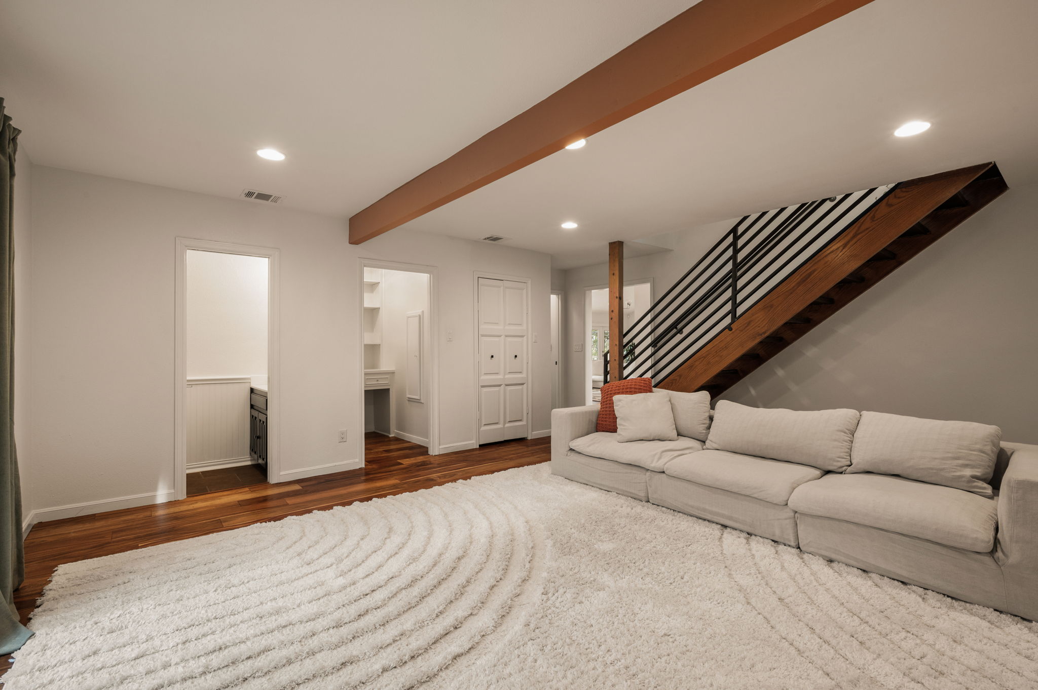 6501 Sumac Drive Austin, TX 78731 - Photo 18 of 40 Living room with recessed lighting, dark wood-type flooring, and beamed ceiling