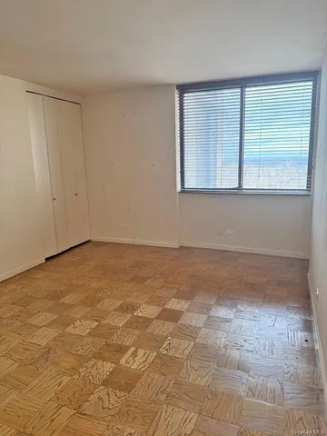 a view of an empty room with a window