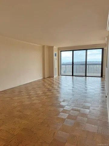 a view of an empty room with a window